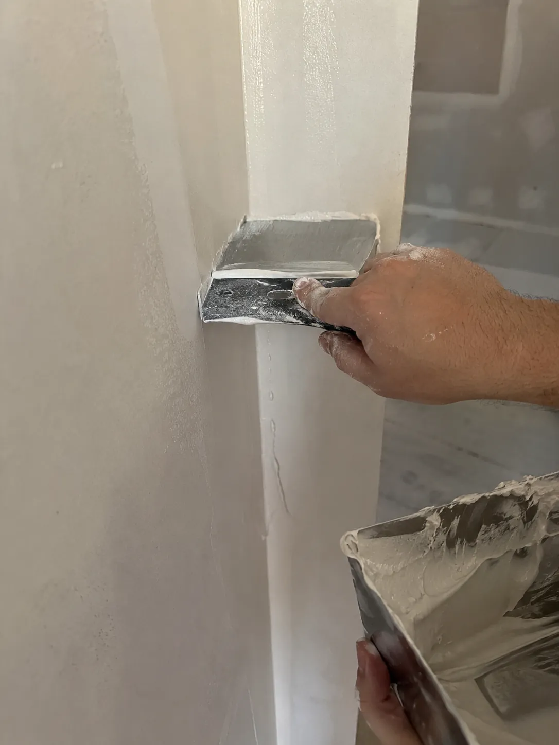 Finishing an inside drywall corner with a corner knife